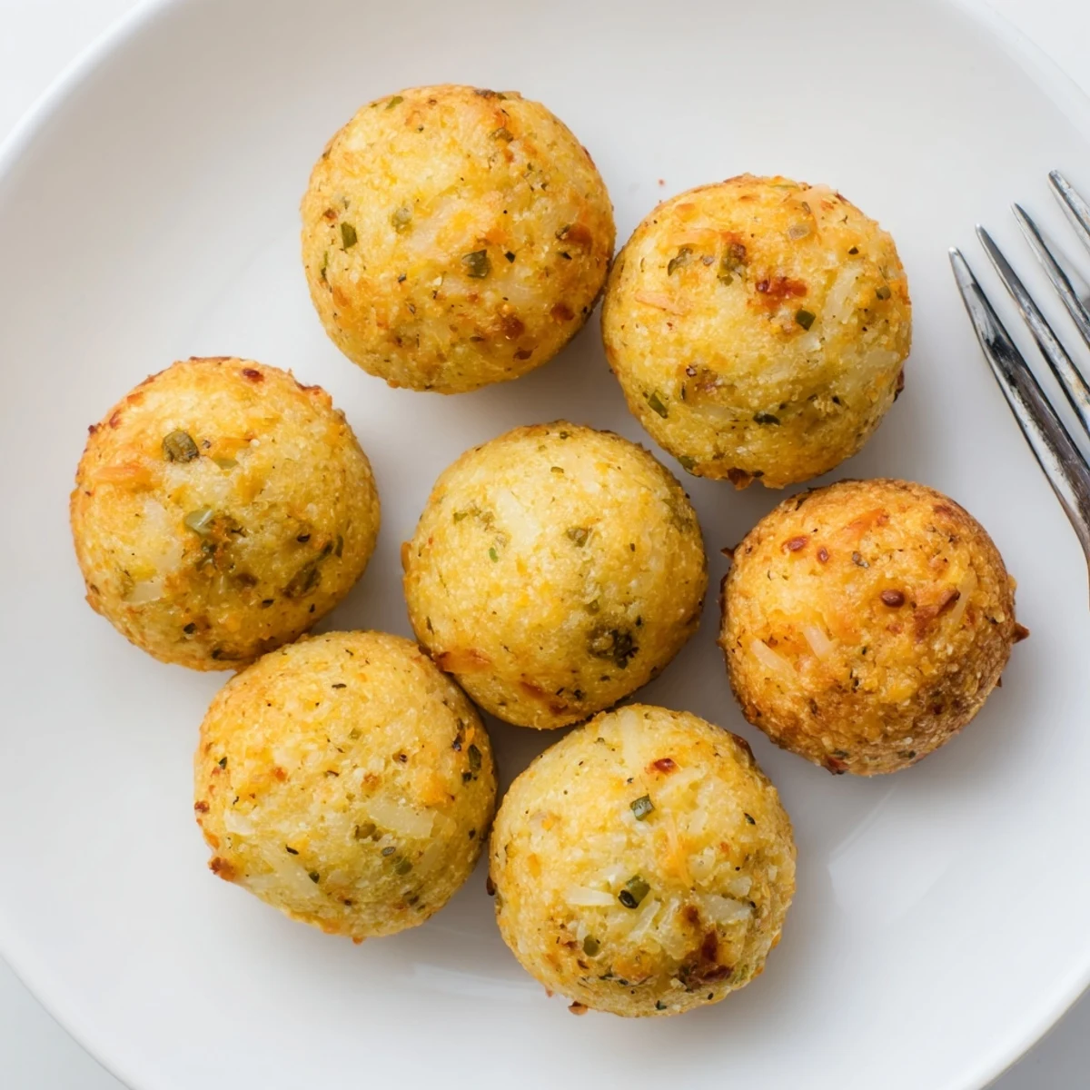 Savory Spicy Ranch Cheddar Muffin Balls, golden brown and inviting, perfect for appetizers.  