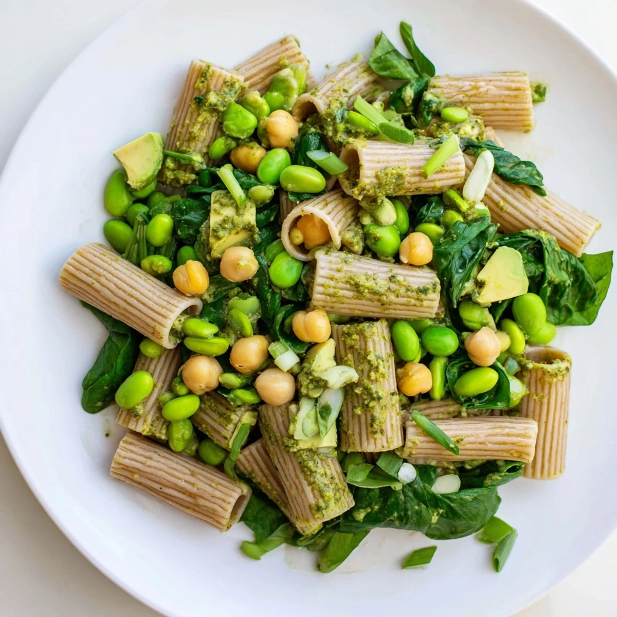 This refreshing Holiday Glow Green Goddess Protein Pasta Salad combines pasta with a creamy green sauce and colorful veggies.