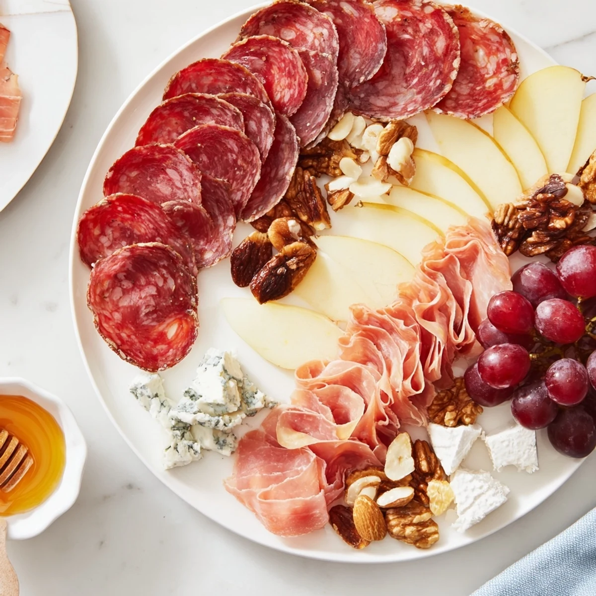 A visually stunning Majestic Venison Charcuterie Platter overflowing with colorful meats, cheeses, and fruits.
