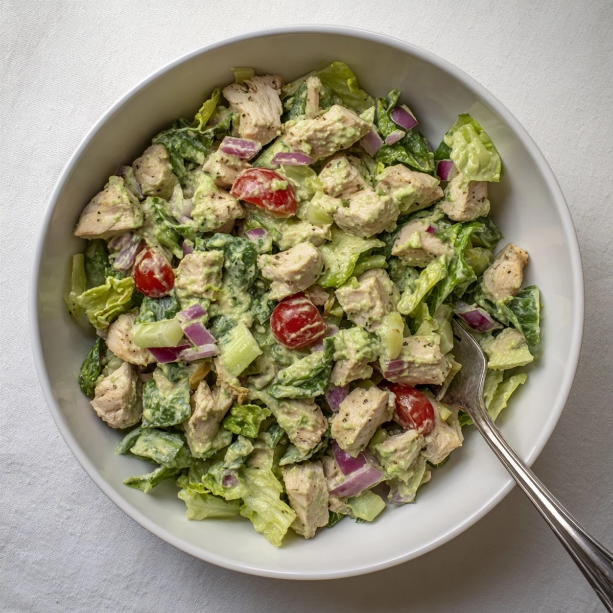 Freshly grilled chicken chunks mixed with creamy avocado ranch dressing, crisp cherry tomatoes, cucumbers, and mixed greens.