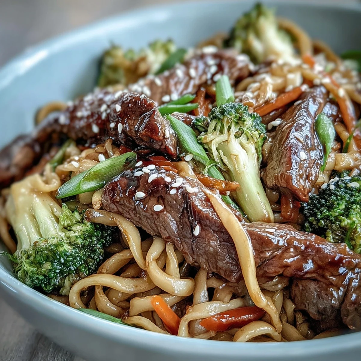 Steaming Korean Beef Noodles with tender flank steak and crisp broccoli.