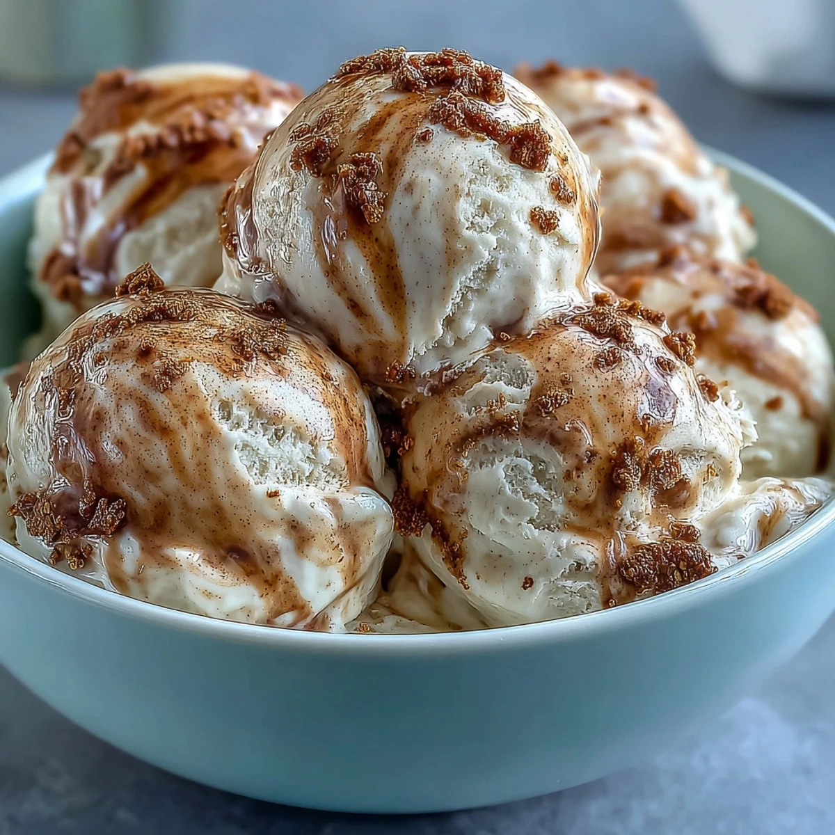 Scoops of creamy Hojicha Ice Cream with a rich roasted green tea aroma are served in a chilled bowl.