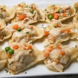 This Chicken and Dumplings Casserole shows a bubbling, savory dish just out of the oven, ready to serve.