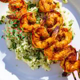 Smoky, grilled Chipotle Lime Shrimp over fluffy rice, a colorful and flavorful Mexican-inspired meal.