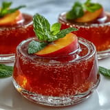 Peach Bellini Jello Cups, a vibrant, boozy dessert perfect for celebrations.