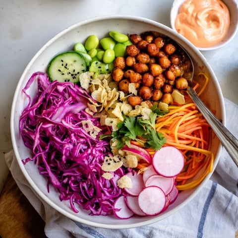 A colorful ASMR Crunch Snack Bowl filled with fresh veggies and crunchy toppings.  