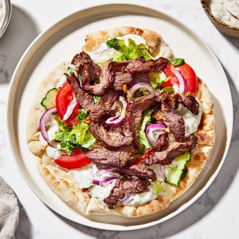Savory beef shawarma wraps, filled with tender spiced meat and cooling creamy yogurt sauce.
