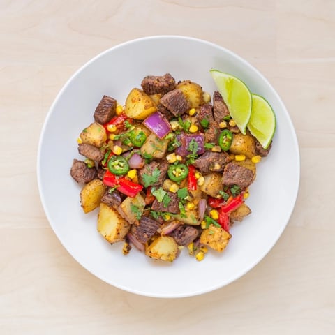 Sizzling Southwest Steak & Potato Skillet with tender steak, vibrant peppers, a flavorful one-pan meal.