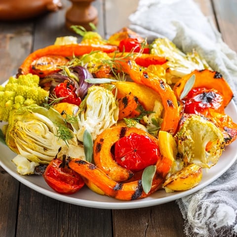 Festive Vegetable Christmas Wreath: A colorful assortment of roasted vegetables arranged beautifully for holiday tables.