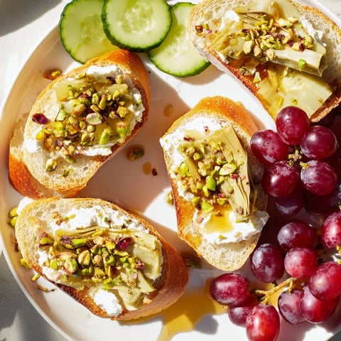 Zero-Proof Celebration Spread arranged for a party, featuring colorful fruits, cheeses, and sparkling beverages.