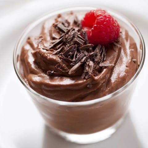 Creamy and decadent chocolate mousse dessert cups, perfectly chilled and ready to serve after a delicious meal.