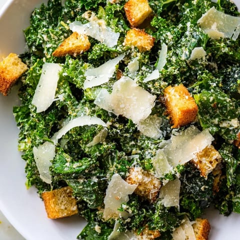 Homemade creamy dressing coats the vibrant green kale in this delicious, vegetarian Kale Caesar Salad.