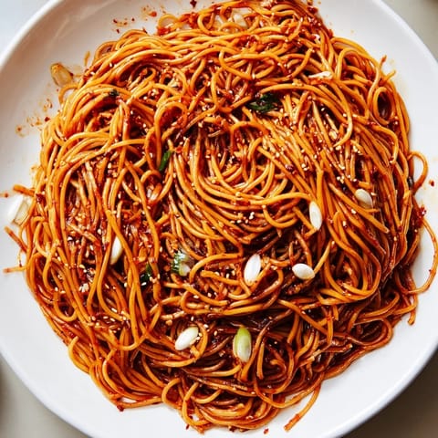 Tender wheat noodles coated in a vibrant garlic chili oil, perfect for savory Garlic Chili Oil Noodles.