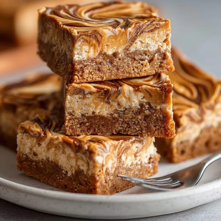 Close-up of moist Peanut Butter Swirl Protein Bars with creamy peanut butter ribbons on top