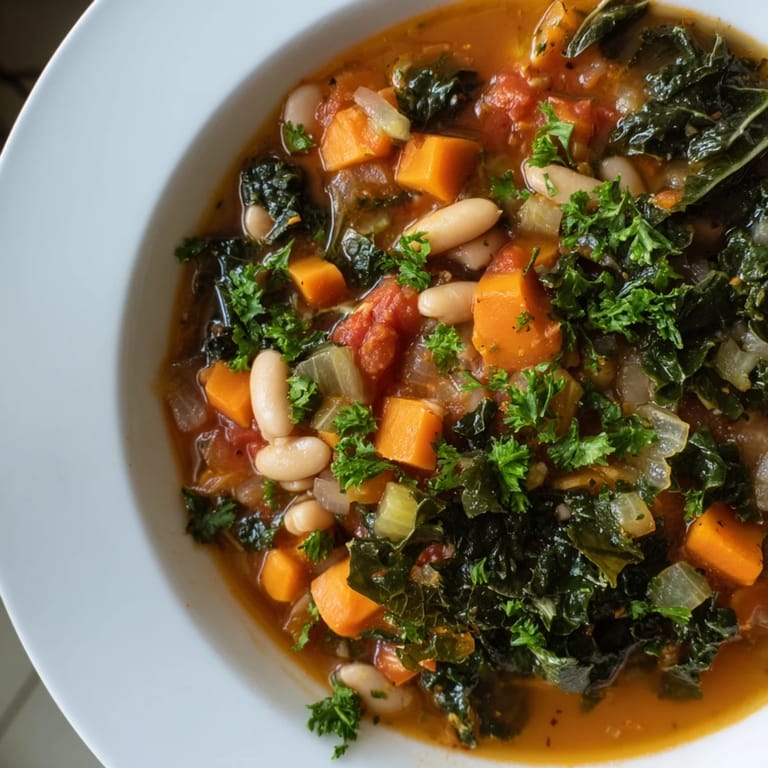 Italian Bean & Kale Stew, with hearty beans and vegetables, ready to be ladled into bowls.