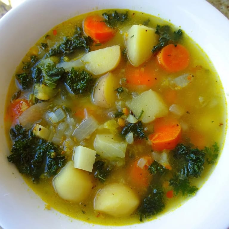A close-up of a rustic bowl of hearty Vegetarian Potato-Kale Soup, perfect for a cozy dinner.