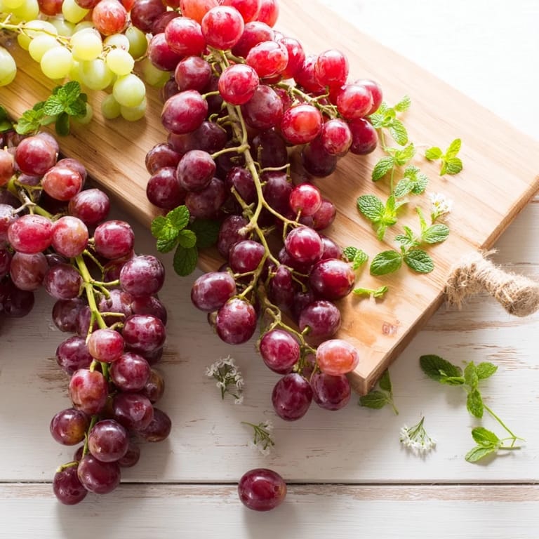 Vibrant grapes overflowing the edge, a beautiful and simple display for your snack or appetizer platter.