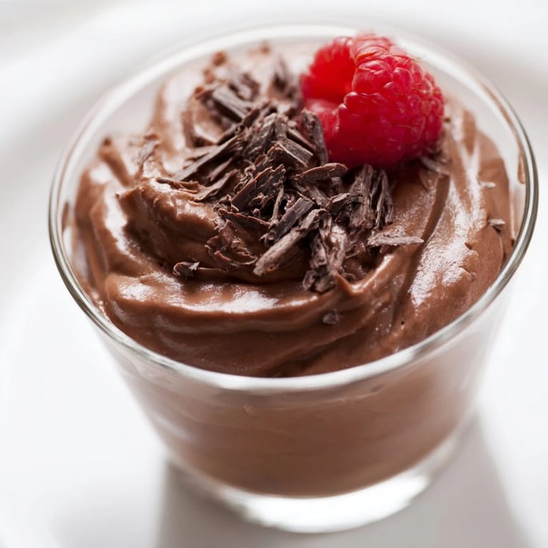 Creamy and decadent chocolate mousse dessert cups, perfectly chilled and ready to serve after a delicious meal.
