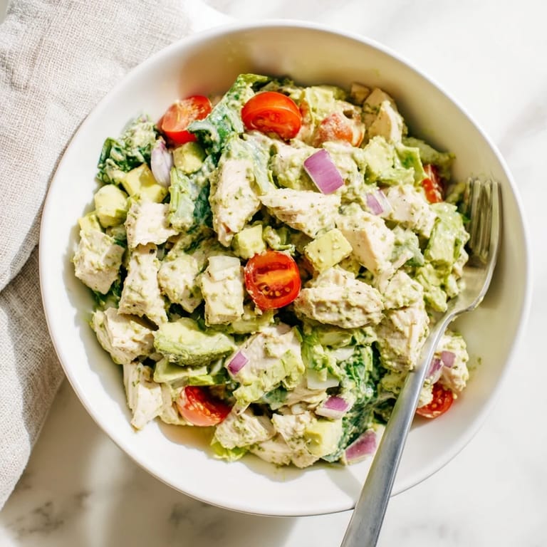 Warm seasoned chicken pieces tossed in a vibrant avocado ranch salad with diced cucumbers, celery, and red onion.