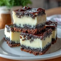 Creamy black sesame cheesecake bars with a nutty aroma on a crisp crust.